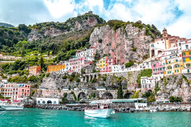 Positano's cliffside beauty, Amalfi's pastel villages and Cinque Terre's colorful fishing hamlets — private boat tours and coastal walks arranged.