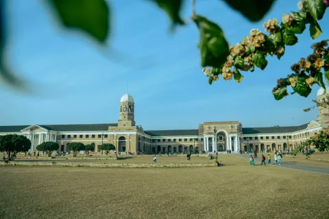 The grand colonial-era building of the Forest Research Institute in Dehradun, with its vast lawns and Greco-Roman architecture