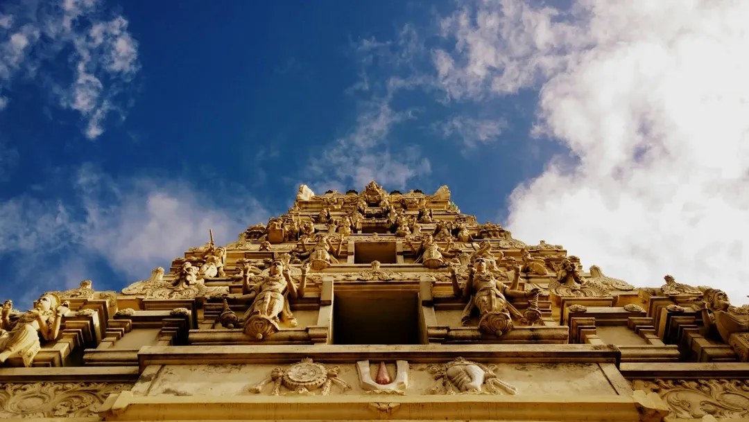 The grand and intricately carved sandstone facade of the Somnath Temple, a revered Hindu pilgrimage site on the coast of Gujarat