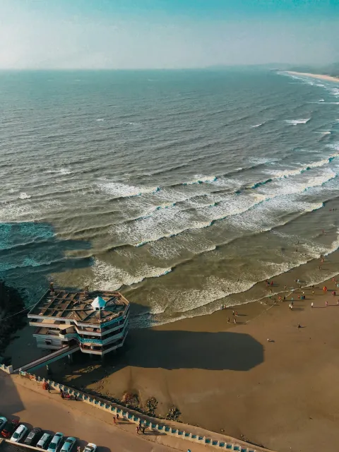 Gokarna beach with rocky shoreline and palms