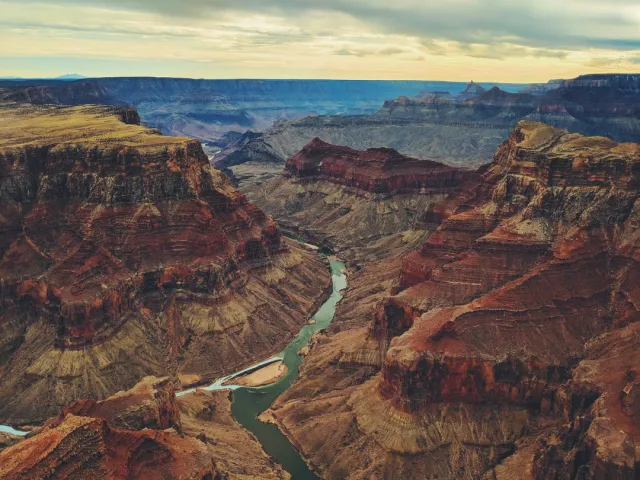 Grand Canyon & Yellowstone – Natural Wonders Grand Canyon vistas and rafting; Yellowstone geysers, hot springs and wildlife safaris — guided sunset and photo tours offered.
