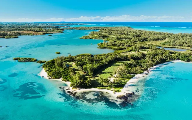 Crystal-clear lagoons and water-sport playgrounds at Île aux Cerfs; Grand Baie for nightlife, shopping and yacht marinas. Private island-hopping and sunset sails organized.