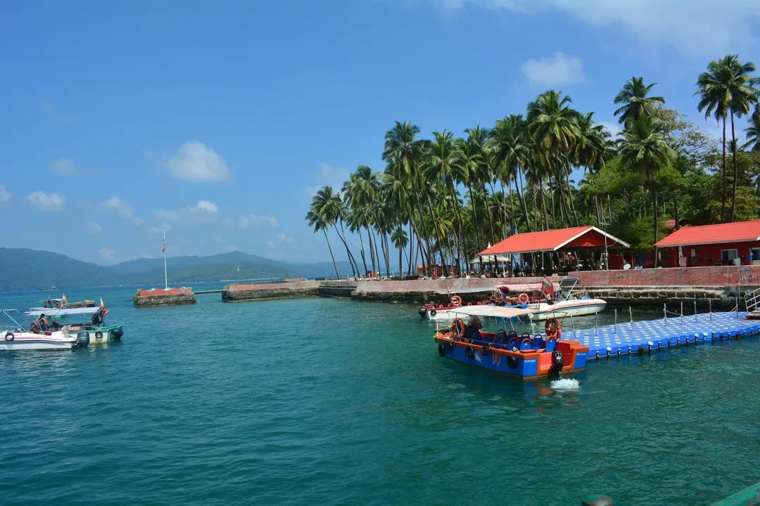 Port Blair waterfront with boats and golden-hour sky