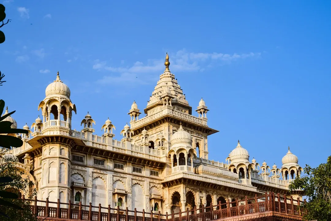 The magnificent facade of the Albert Hall Museum, the oldest museum in Rajasthan, with its intricate domes and towers against a blue sky