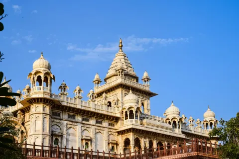 The magnificent facade of the Albert Hall Museum, the oldest museum in Rajasthan, with its intricate domes and towers against a blue sky